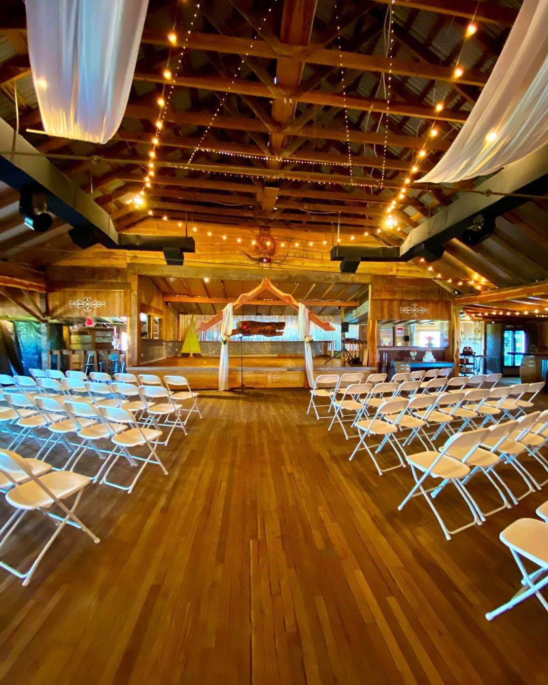 indoor rustic wedding ceremony with stage