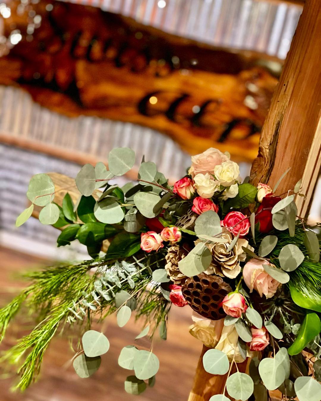 wedding floral arrangement with pink roses and fake honeycomb