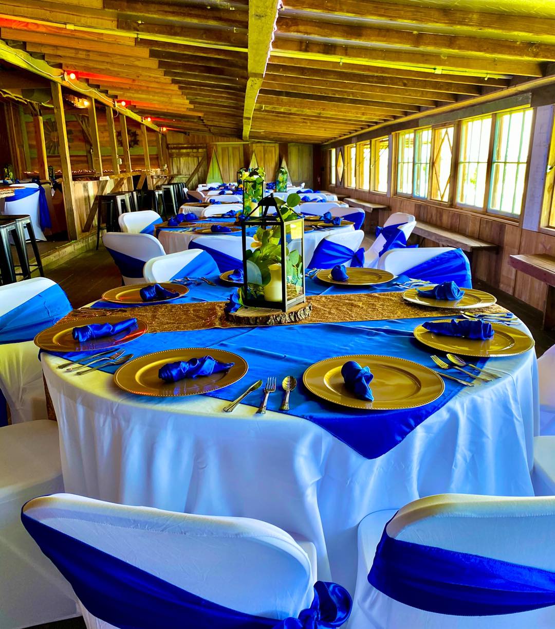 wedding reception table decorated with gold and blue