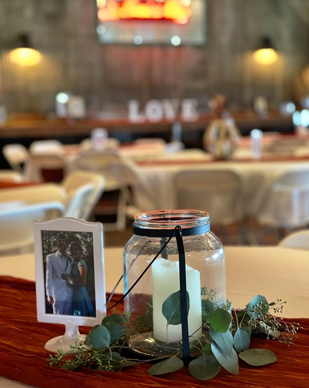 wedding decoration with picture of bride and groom as teenagers